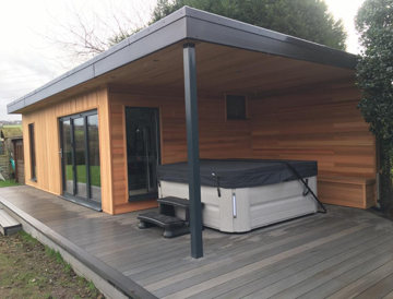 Garden Room with a canopy and hot tub